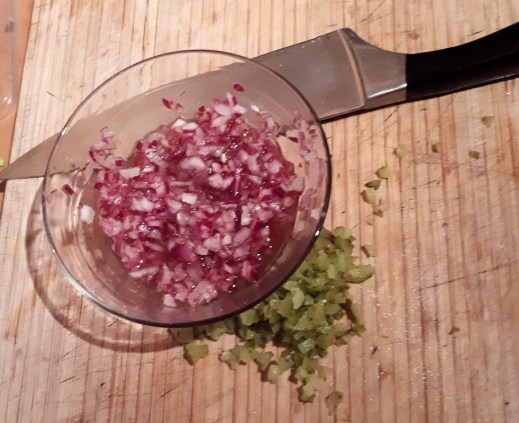chopped red onion and gherkin